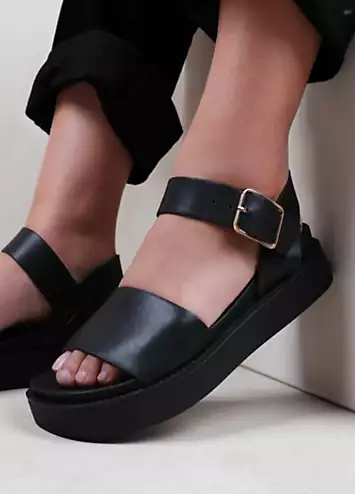 Phoenix Black Buckle Flat Sandals by Where’s That From | Look Again