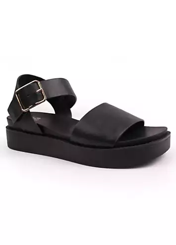 Phoenix Black Buckle Flat Sandals by Where’s That From | Look Again